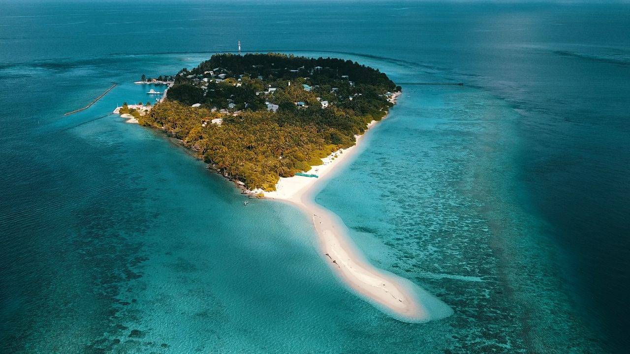 Aerial view of a Maldivian island served by Ecogreen Maldives